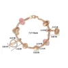 Armband med flera berlocker