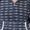 Huvtröja med kort ärm, dragkedja och logostripe