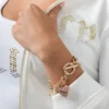 Rosa Pava-hjärta med toggle-lås som armband